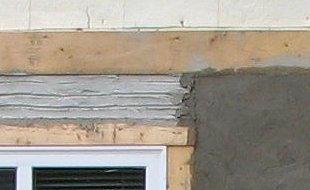 Image - brown coat over scratch - stucco